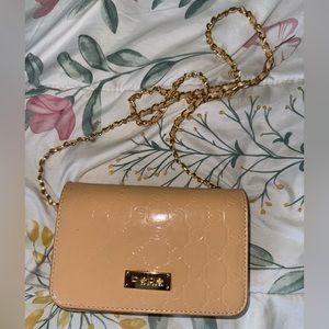 Bebe Strap clutch peach colored in great condition